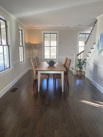 5 Pleasant Street, Unit 3 Hingham, MA 02043 - Photo 7 of 25 a view of a dining room with furniture window and wooden floor