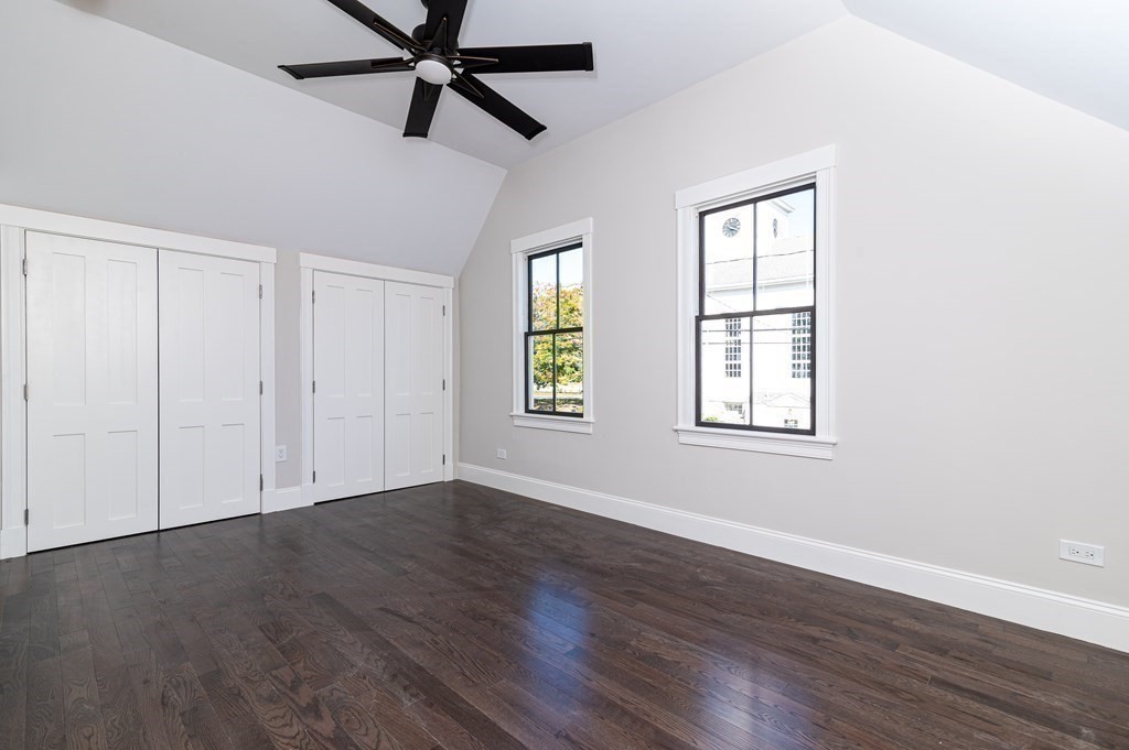5 Pleasant Street, Unit 3 Hingham, MA 02043 - Photo 10 of 25 a view of an empty room with wooden floor and a window