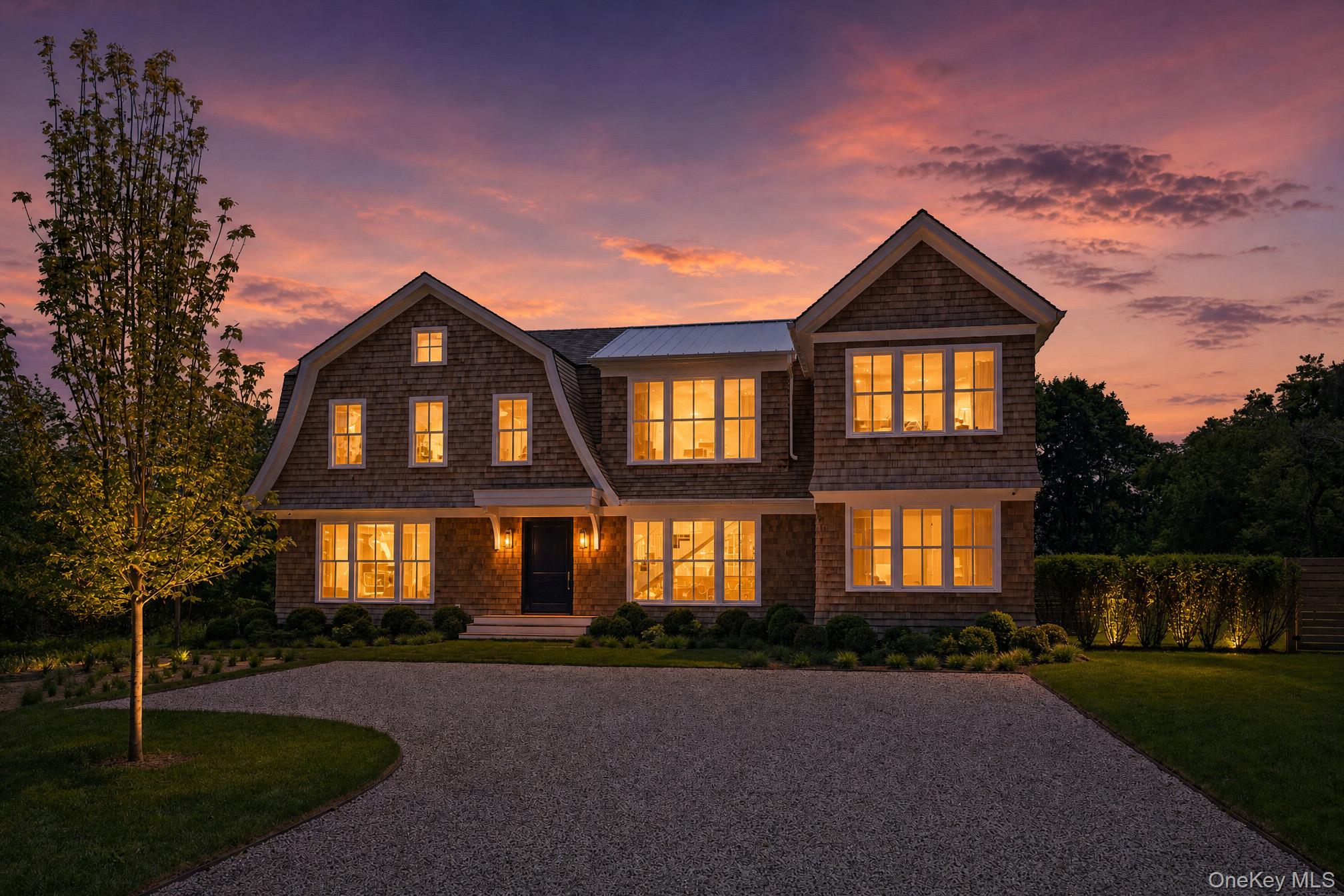161 South Road Westhampton, NY 11977 - Photo 3 of 36 Twilight exterior showcasing this extraordinary new waterfront construction, where elegant design meets serene coastal luxury and breathtaking waterfront surroundings.