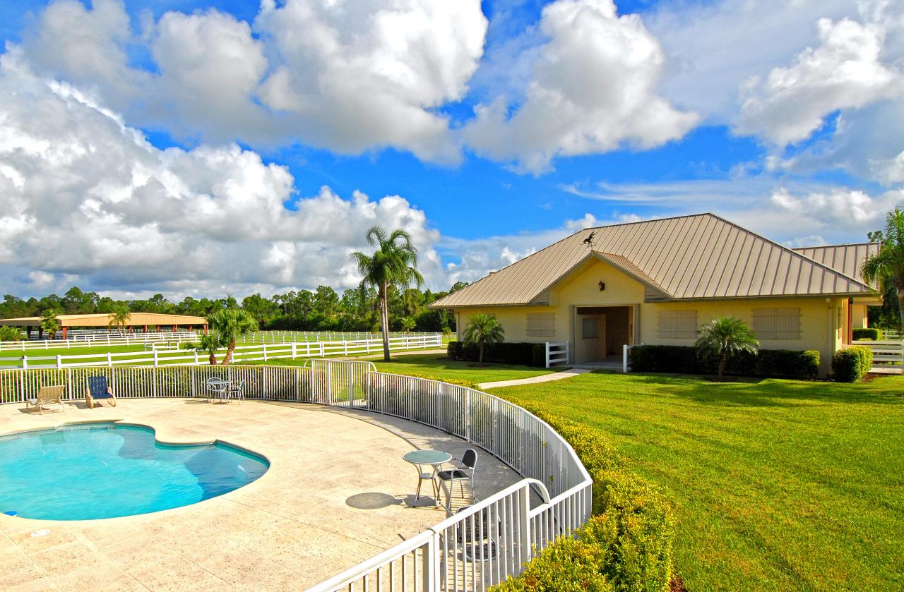 2300 Southeast Ranch Road South Jupiter, FL 33478 - Photo 3 of 44 a view of a house with a swimming pool