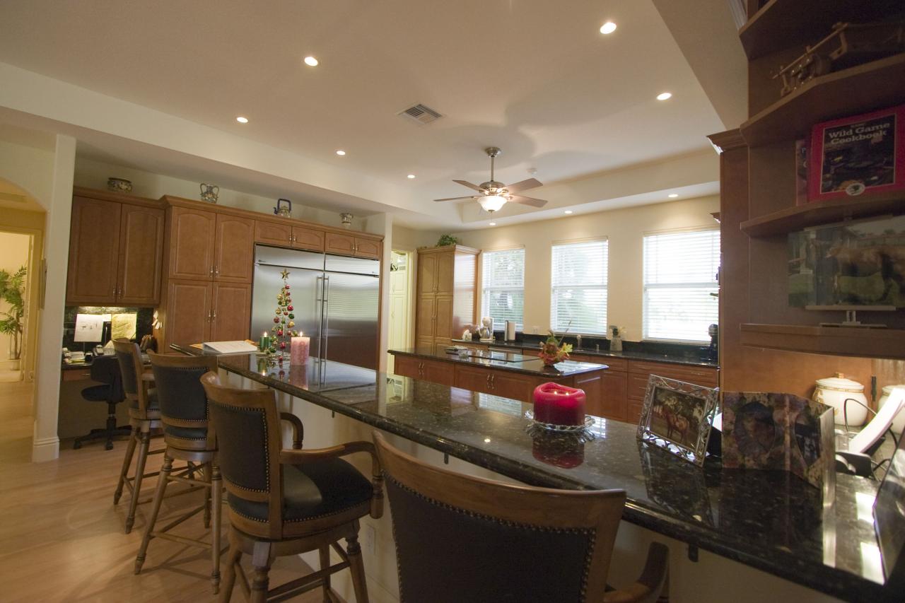 2300 Southeast Ranch Road South Jupiter, FL 33478 - Photo 25 of 44 a kitchen with counter space dining table and chairs