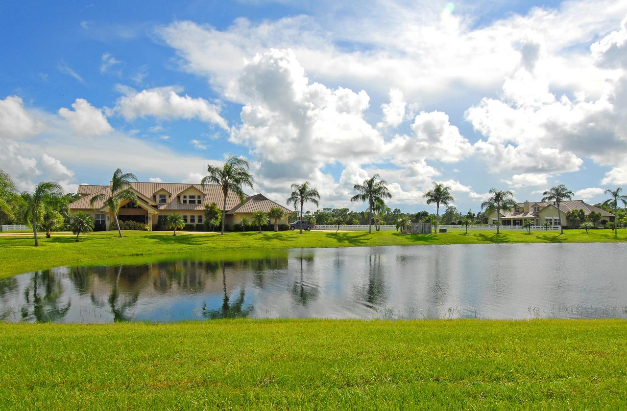2300 Southeast Ranch Road South Jupiter, FL 33478 - Photo 29 of 44 a view of a lake with houses in the background