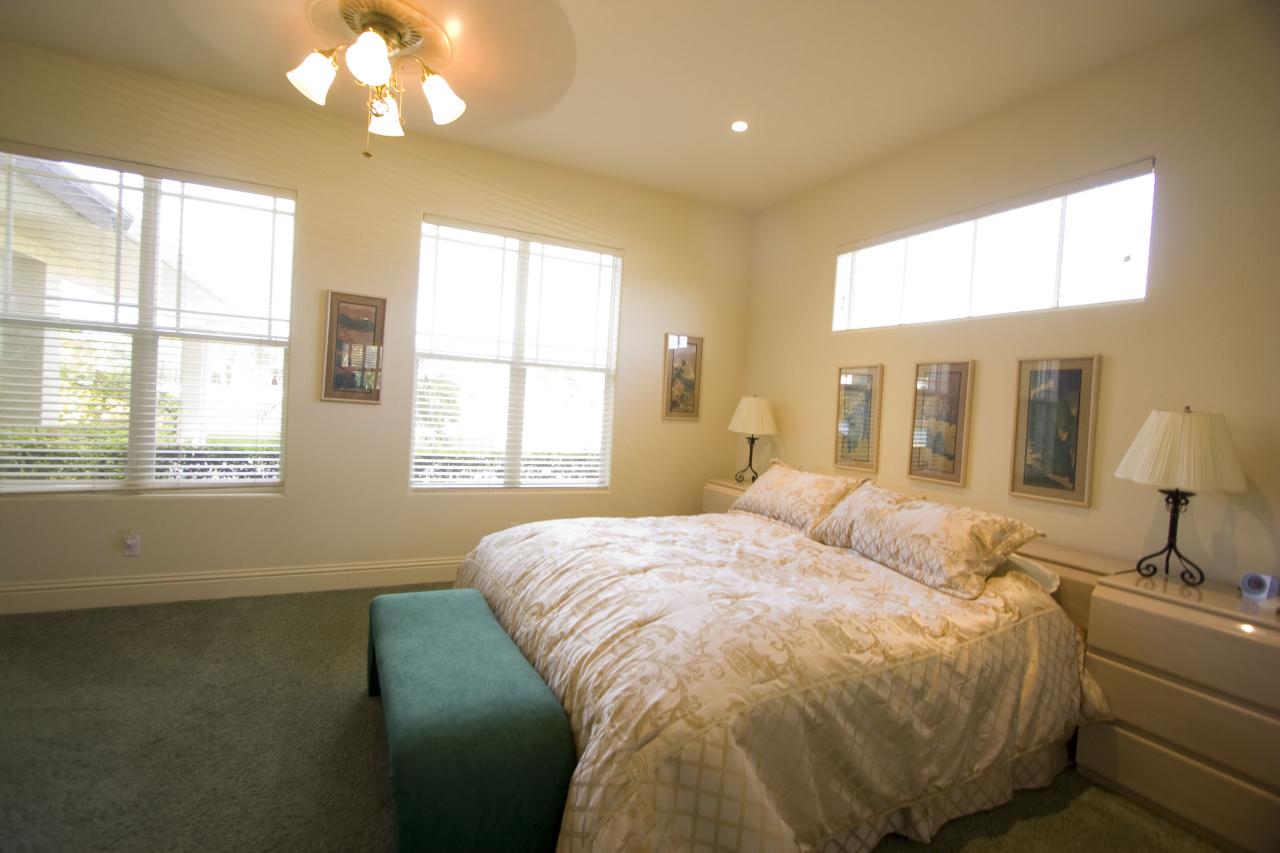 2300 Southeast Ranch Road South Jupiter, FL 33478 - Photo 36 of 44 a bedroom with a bed and a large window