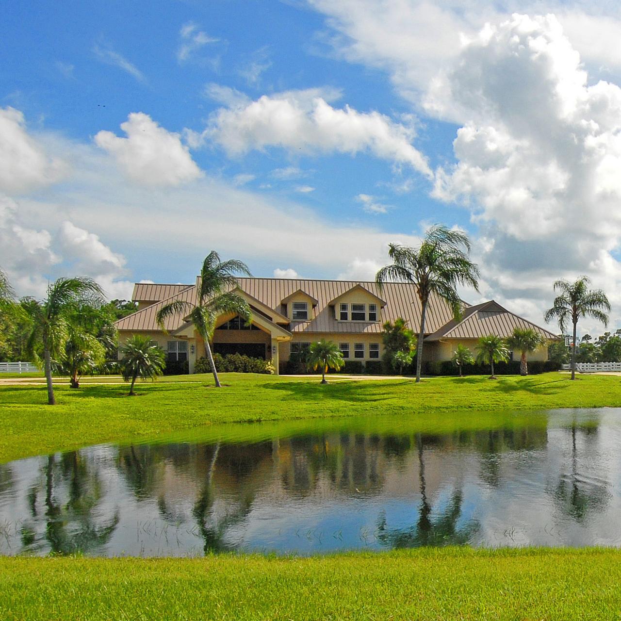 2300 Southeast Ranch Road South Jupiter, FL 33478 - Photo 7 of 44 a view of a lake with a house in the background
