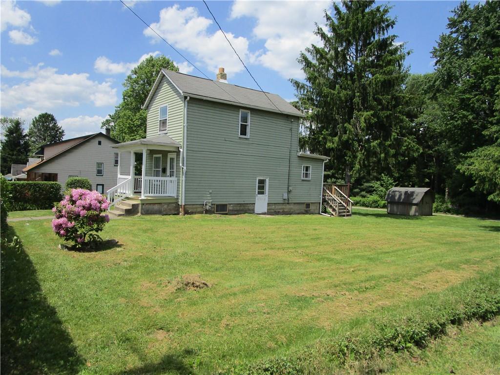 1124 Webster Street Farrell, PA 16121 - Photo 4 of 17 a front view of house with yard and seating area