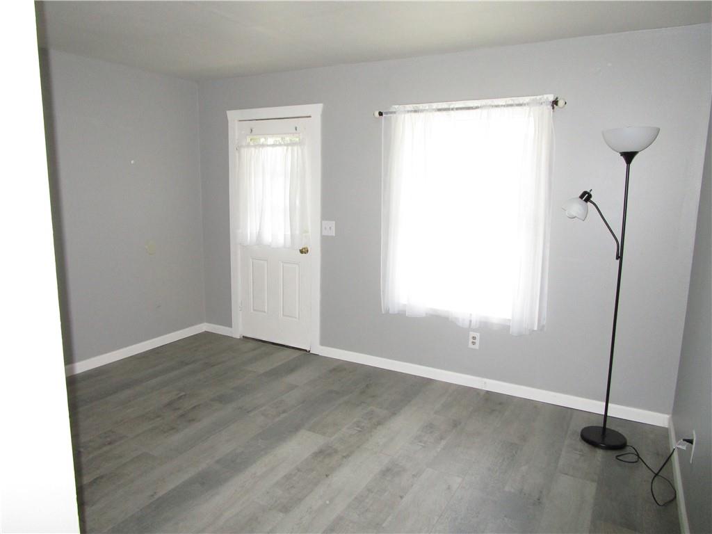 1124 Webster Street Farrell, PA 16121 - Photo 5 of 17 a view of an empty room with a window
