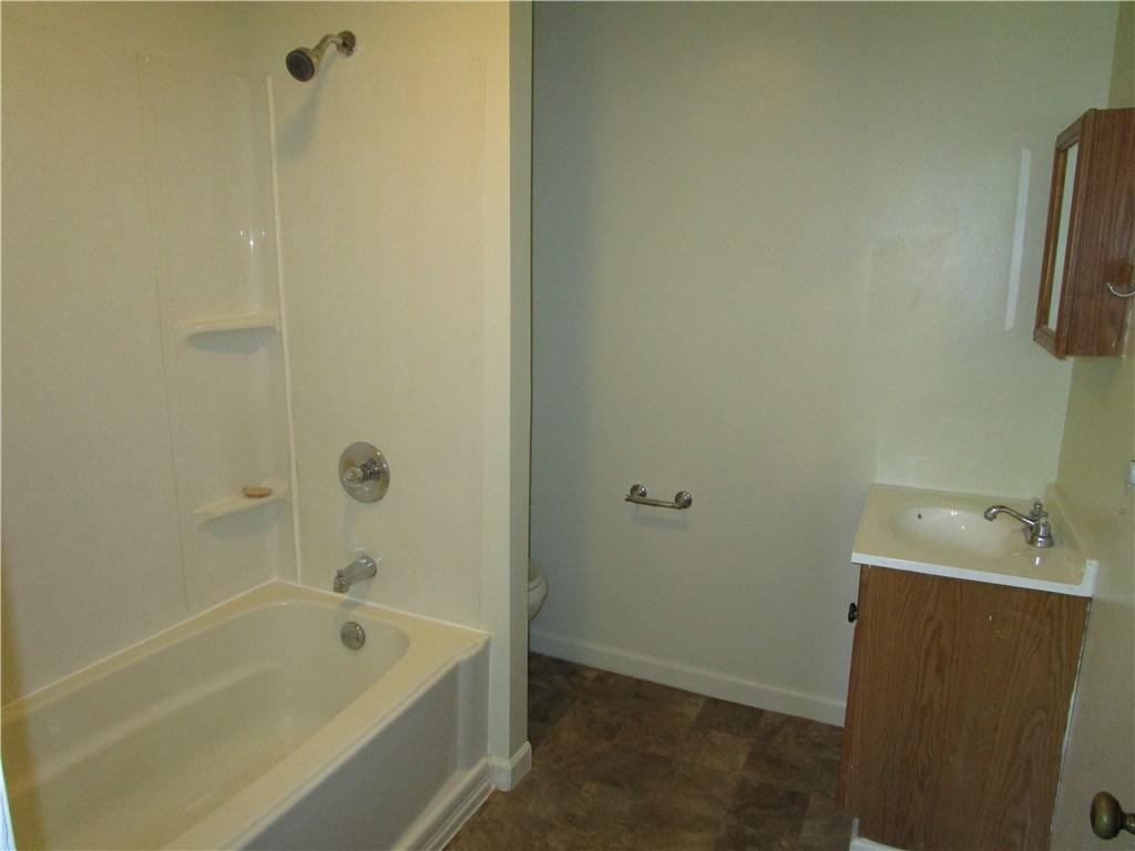 1124 Webster Street Farrell, PA 16121 - Photo 9 of 17 a bathroom with a tub a sink and a shower