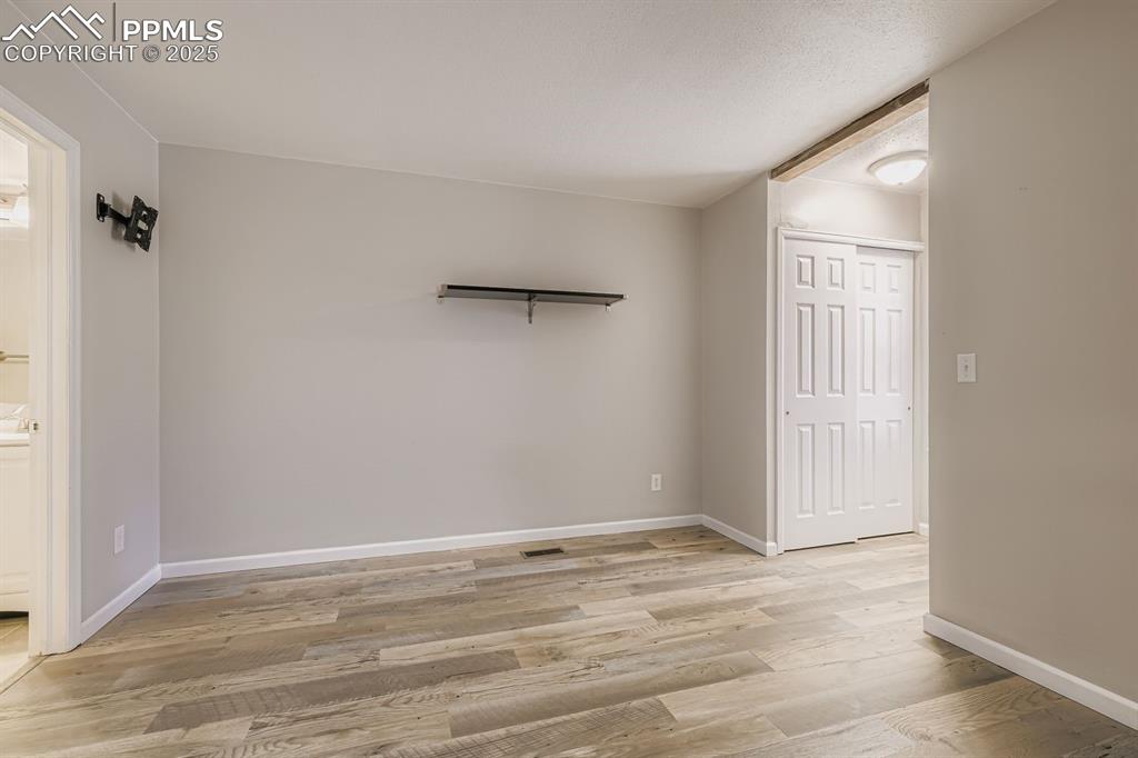 Undisclosed Address Colorado Springs, CO 80917 - Photo 6 of 11 a view of a room with wooden floor and bathroom