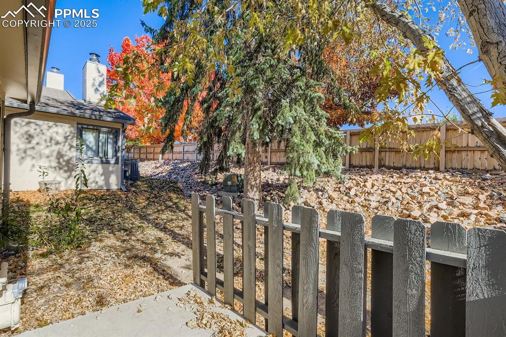 Undisclosed Address Colorado Springs, CO 80917 - Photo 10 of 11 a front view of a house with a tree
