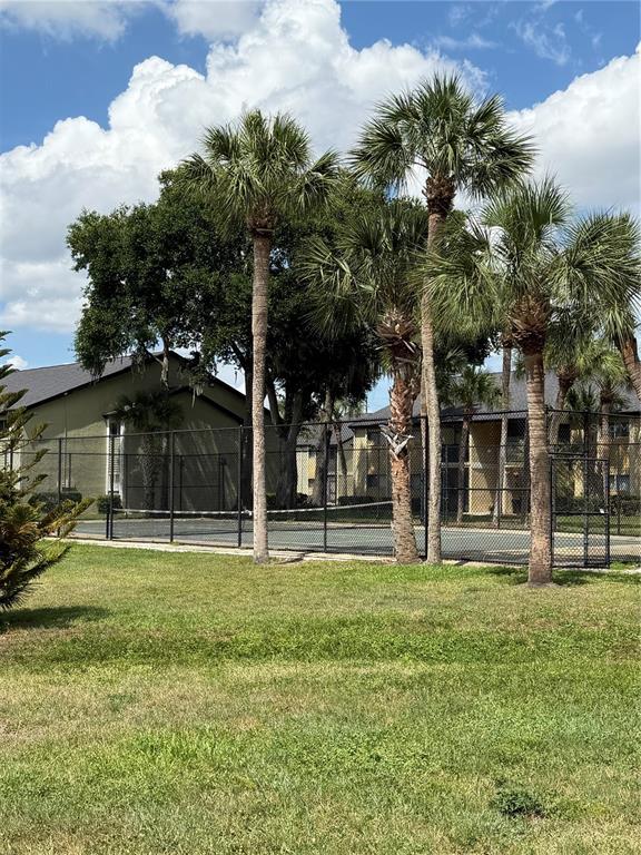 908 Lake Destiny Road, Unit B Altamonte Springs, FL 32714 - Photo 13 of 16 a view of a house with a yard