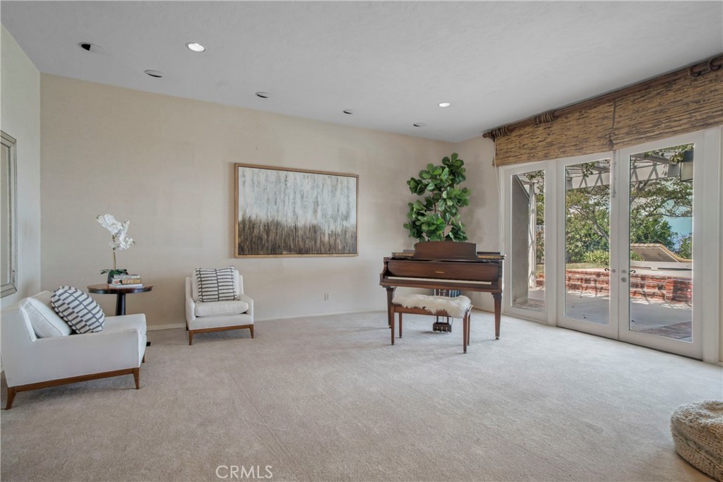 16355 Tudor Drive Encino, CA 91436 - Photo 11 of 51 a living room with furniture and a potted plant