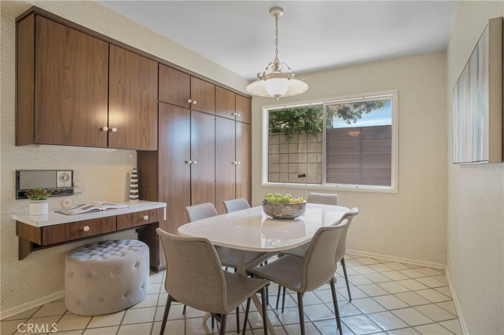 16355 Tudor Drive Encino, CA 91436 - Photo 17 of 51 a view of a dining room with furniture window and wooden floor
