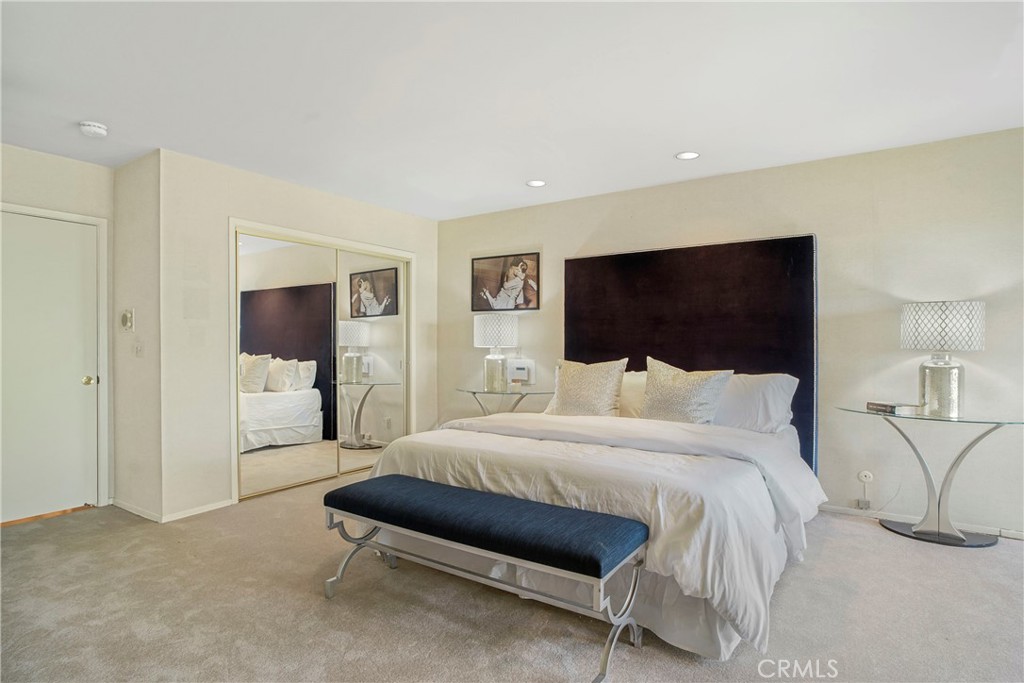 16355 Tudor Drive Encino, CA 91436 - Photo 20 of 51 a bedroom with a bed and a flat screen tv