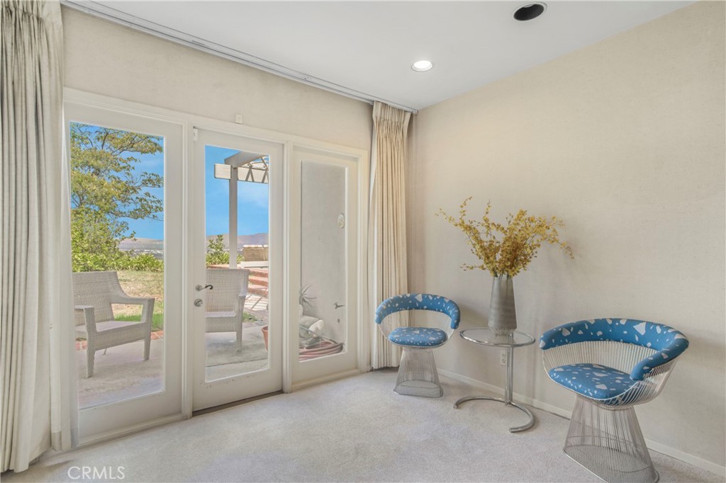 16355 Tudor Drive Encino, CA 91436 - Photo 21 of 51 a view of a room with shelves and potted plants
