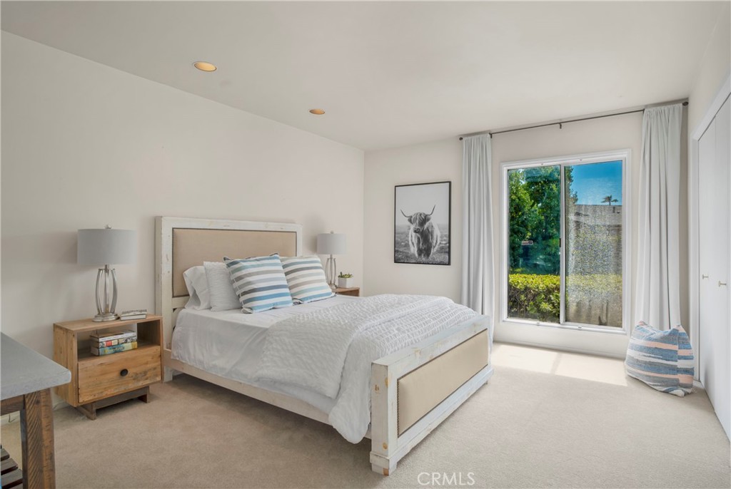 16355 Tudor Drive Encino, CA 91436 - Photo 27 of 51 a bedroom with a bed and large window