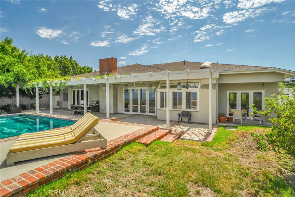 16355 Tudor Drive Encino, CA 91436 - Photo 35 of 51 a view of house with a backyard space and balcony