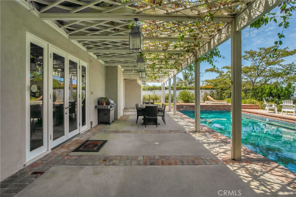 16355 Tudor Drive Encino, CA 91436 - Photo 38 of 51 a view of a porch with a patio