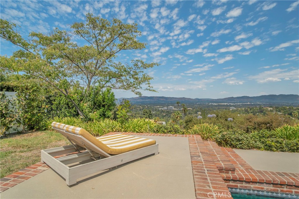 16355 Tudor Drive Encino, CA 91436 - Photo 41 of 51 a view of a terrace with a lake view