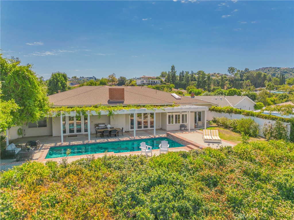 16355 Tudor Drive Encino, CA 91436 - Photo 45 of 51 a view of a house with a big yard and large trees