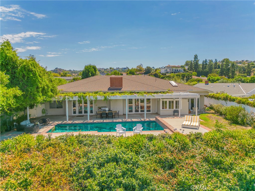 16355 Tudor Drive Encino, CA 91436 - Photo 46 of 51 a view of a house with a big yard and potted plants