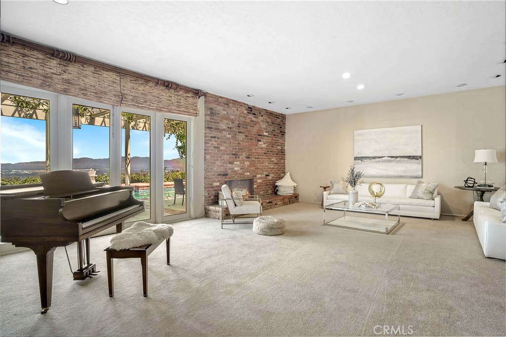 16355 Tudor Drive Encino, CA 91436 - Photo 7 of 51 a living room with furniture and wooden floor