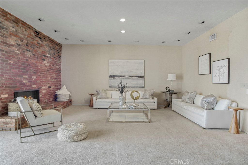 16355 Tudor Drive Encino, CA 91436 - Photo 9 of 51 a living room with furniture and a fireplace