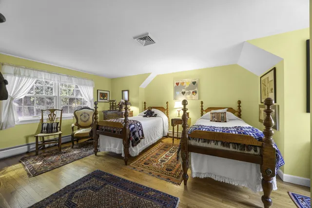 a bedroom with bed and a window