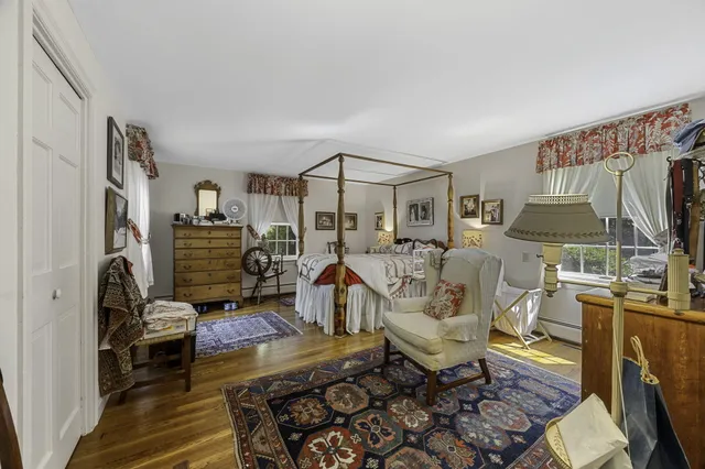 a living room with furniture a window and gym equipment