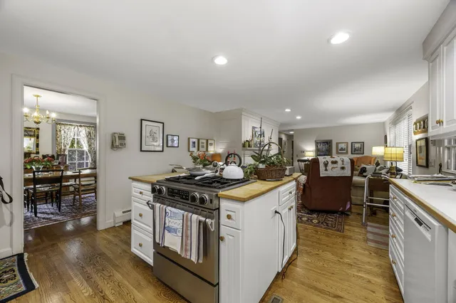 a kitchen with stainless steel appliances granite countertop a stove and a refrigerator