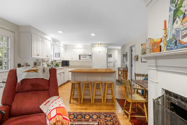 a living room with a couch and a fireplace