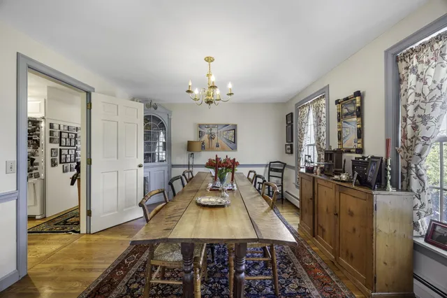 a very nice looking dining room with a table and chairs