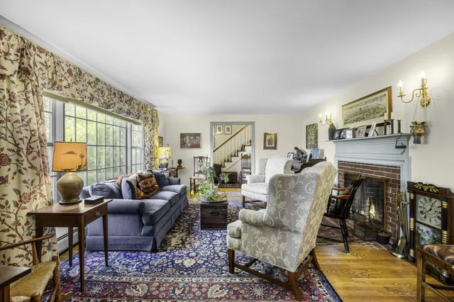 a living room with furniture or couch and a fireplace
