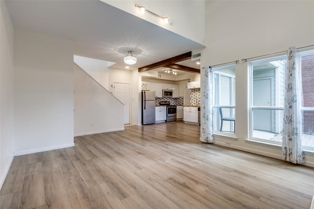 8404 Forest Lane, Unit 702 Dallas, TX 75243 - Photo 4 of 12 a view of empty room with wooden floor