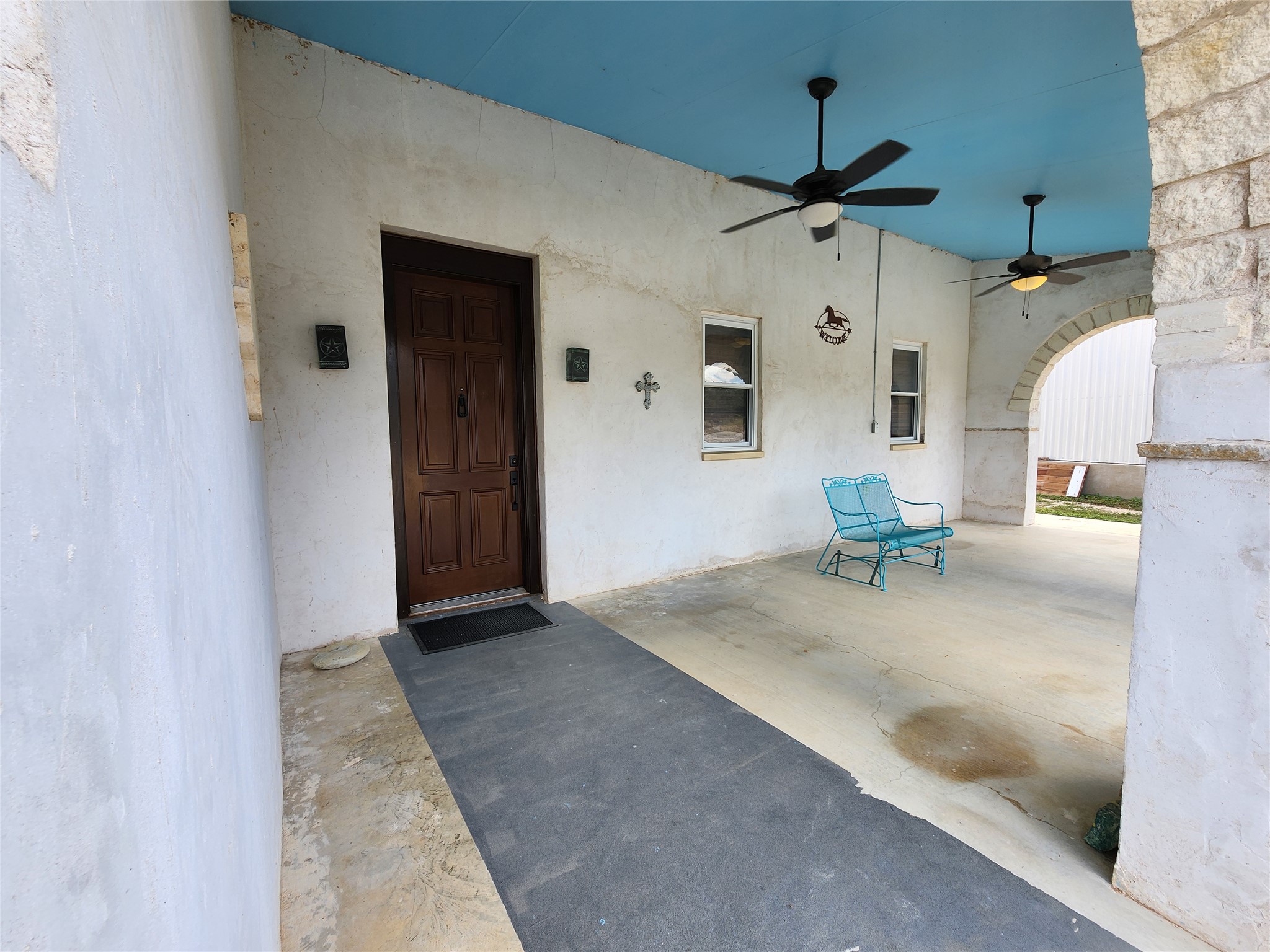 500 Spring Creek Road Florence, TX 76527 - Photo 12 of 38 Huge covered from porch perfect for sitting out and feeling the breeze. Big enough that you don't have to run inside when it rains.
