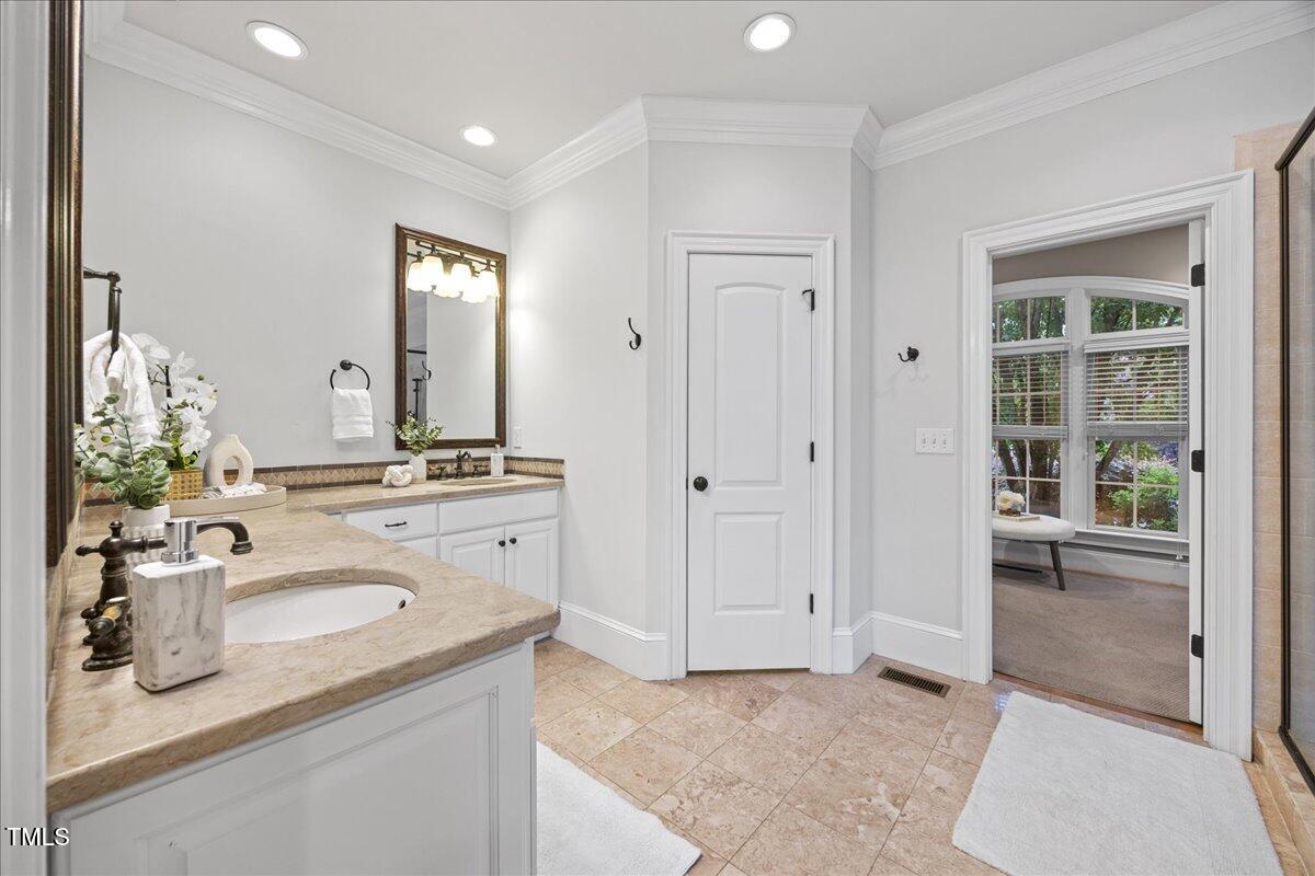 2507 Mayview Road Raleigh, NC 27607 - Photo 27 of 53 Large primary bath with 2 sinks, water closet, soaking tub, and shower enclosure