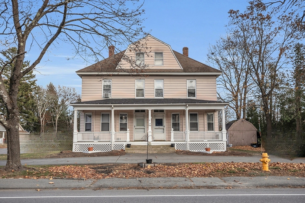 24 Lancaster Road Shirley, MA 01464 - Photo 1 of 35 a front view of a house with a yard