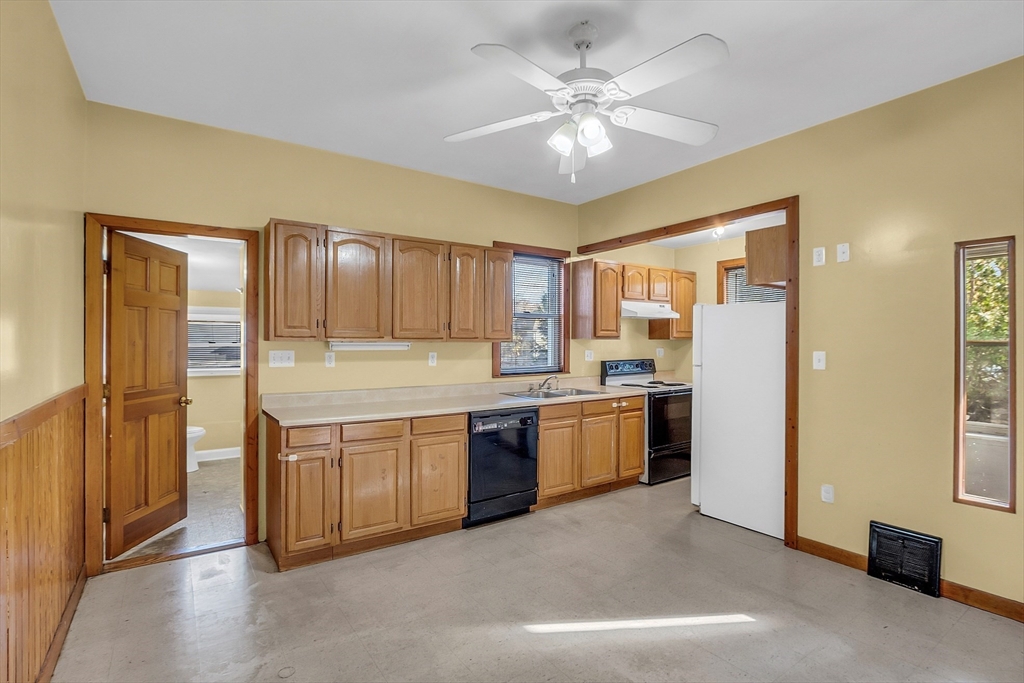 24 Lancaster Road Shirley, MA 01464 - Photo 21 of 35 a large kitchen with stainless steel appliances granite countertop a refrigerator and a stove top oven