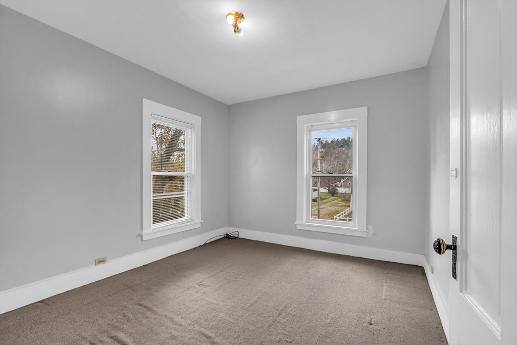 24 Lancaster Road Shirley, MA 01464 - Photo 29 of 35 an empty room with windows and closet