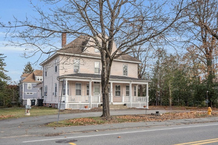 24 Lancaster Road Shirley, MA 01464 - Photo 3 of 35 a front view of a house with a yard