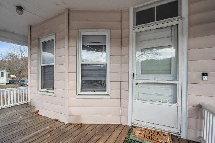 24 Lancaster Road Shirley, MA 01464 - Photo 8 of 35 a view of a porch with wooden floor and windows