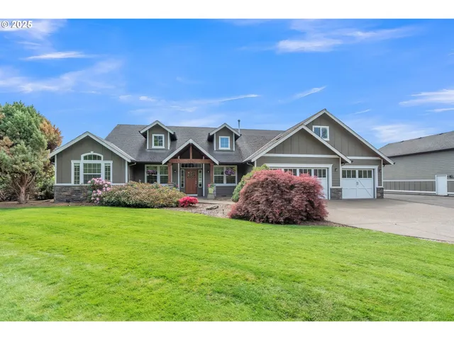 a front view of house with yard and green space