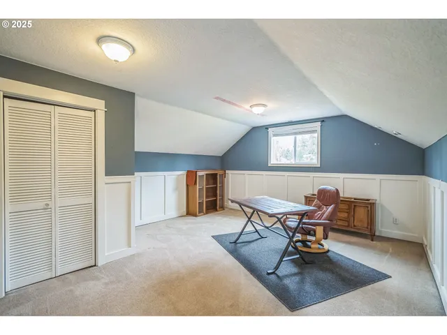 a work room with furniture and wooden floor