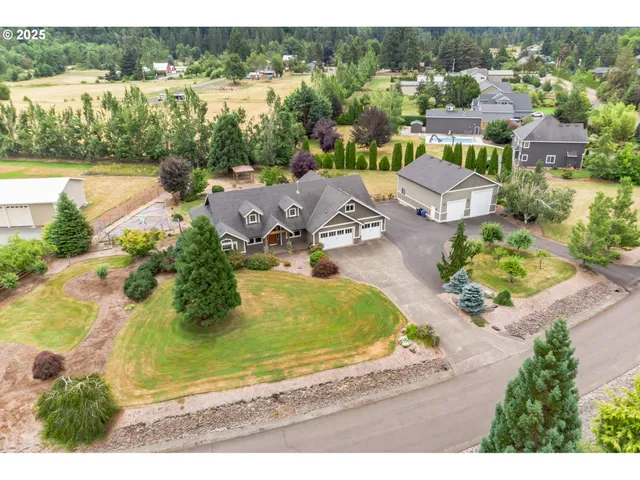 an aerial view of residential houses with outdoor space