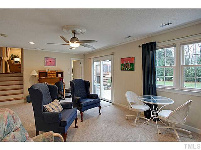 4701 Stiller Street Raleigh, NC 27609 - Photo 23 of 25 a living room with furniture and a large window