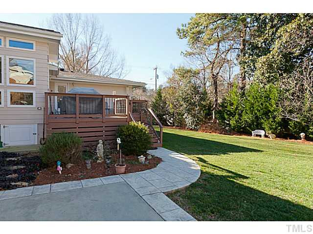 4701 Stiller Street Raleigh, NC 27609 - Photo 24 of 25 a view of backyard of house with green space