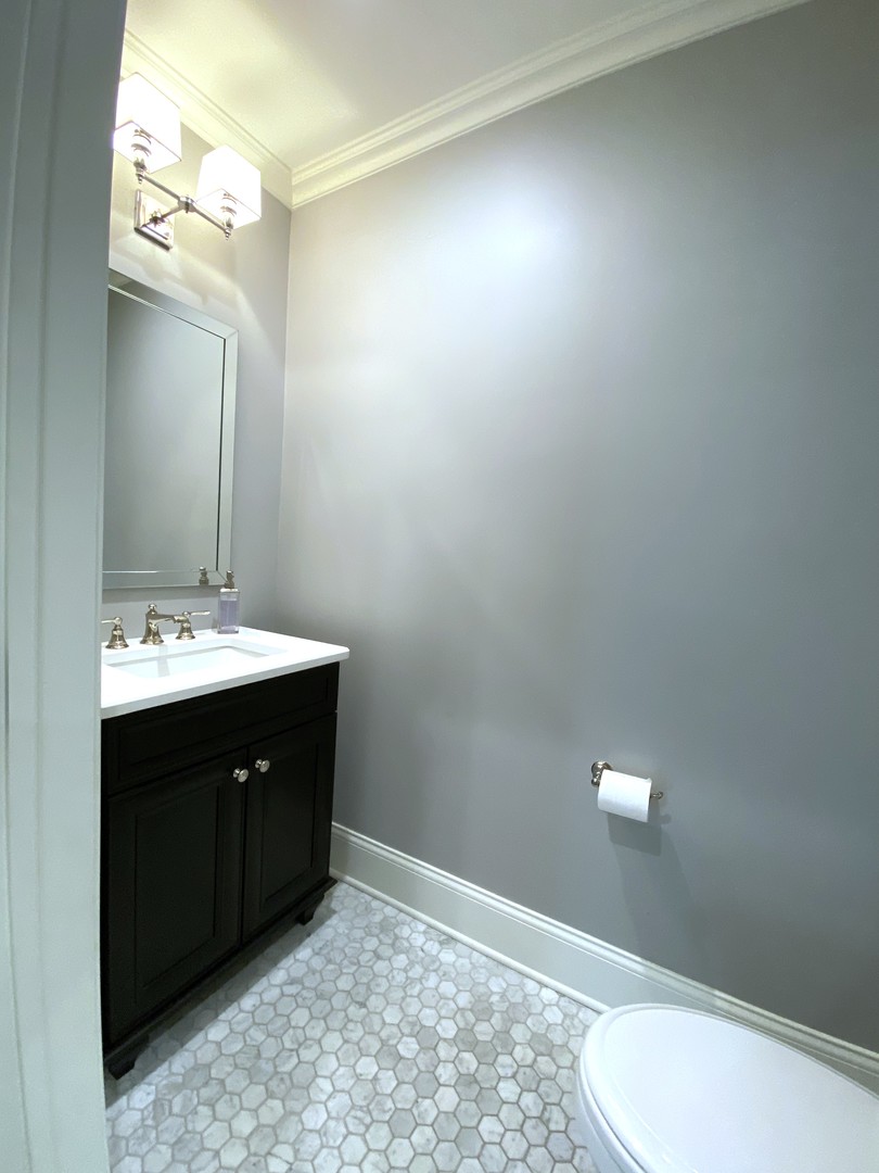 60 Sheridan Road Highland Park, IL 60035 - Photo 15 of 30 a bathroom with a sink vanity and toilet