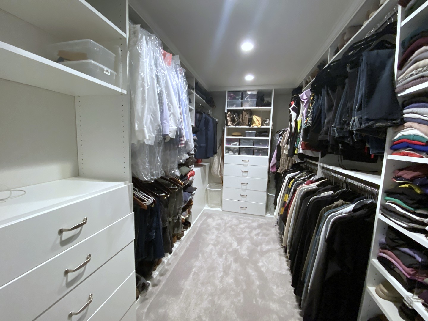 60 Sheridan Road Highland Park, IL 60035 - Photo 17 of 30 a view of walk in closet with clothes and shoes