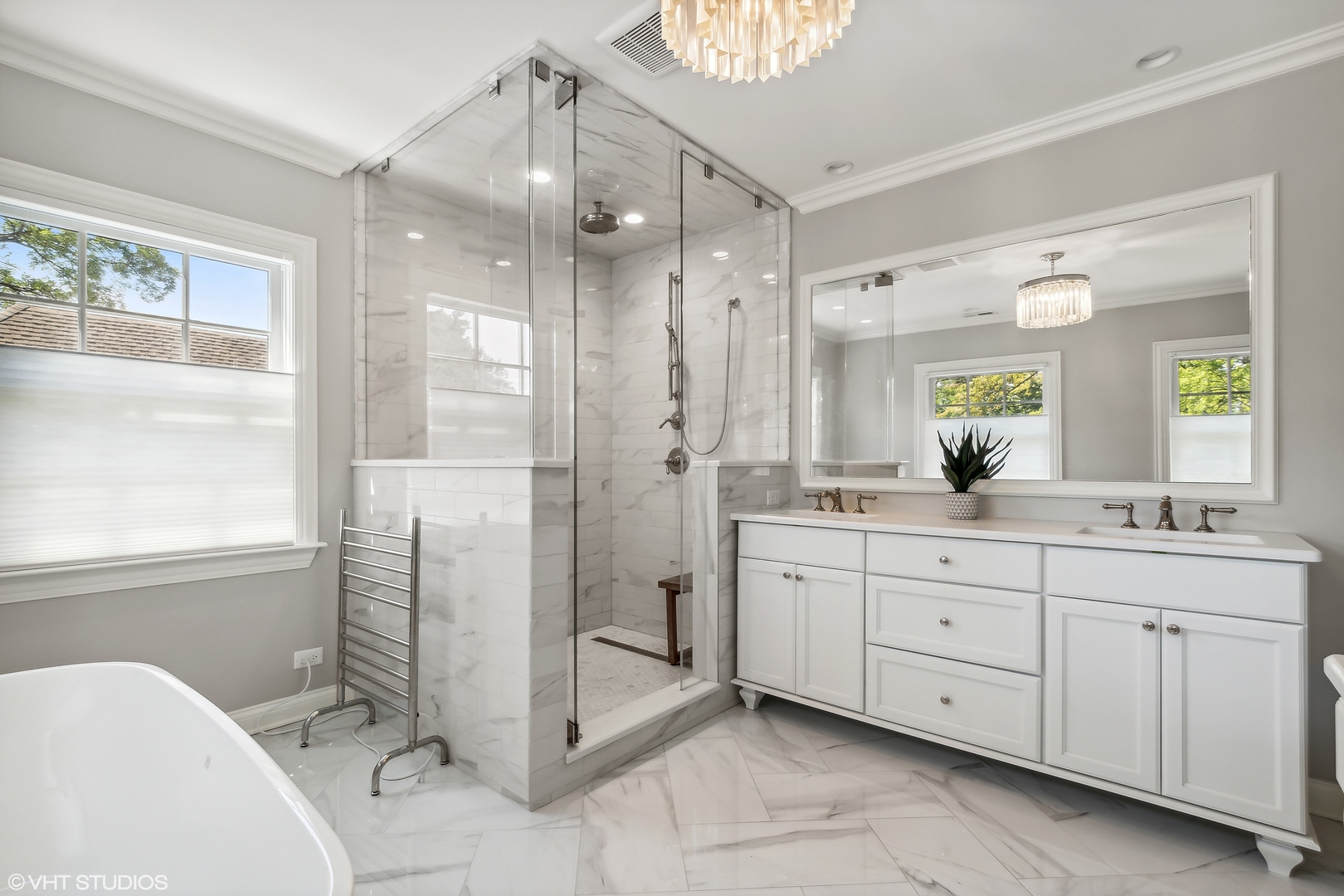 60 Sheridan Road Highland Park, IL 60035 - Photo 18 of 30 a spacious bathroom with a granite countertop sink mirror and a bathtub