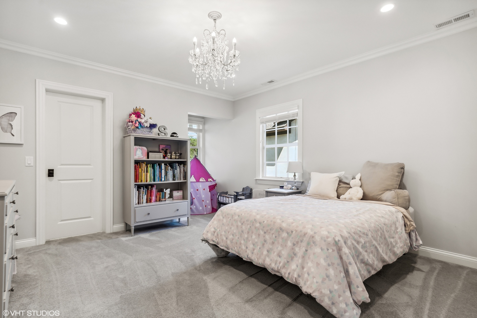 60 Sheridan Road Highland Park, IL 60035 - Photo 21 of 30 a bedroom with a bed and a chandelier