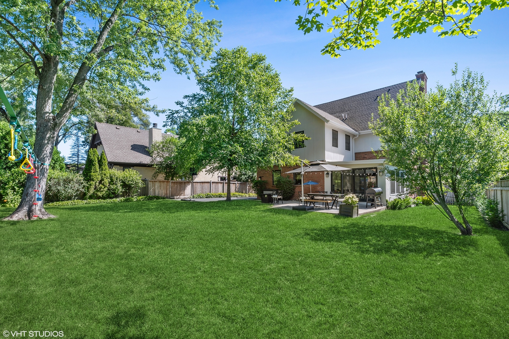 60 Sheridan Road Highland Park, IL 60035 - Photo 30 of 30 a view of a house with backyard sitting area and garden
